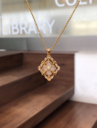 "Ethereal Spinner" Pink Mother-of-Pearl Clover Necklace – A Rotating Token of Luck